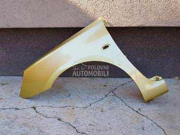 Krilo levo zlatno KAWC za Peugeot 307