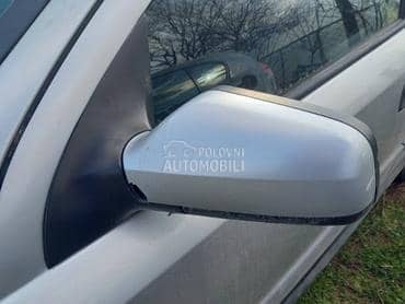 Levi retrovizor sivi ostecen za Opel Astra G