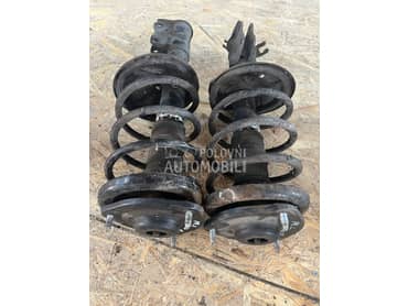 Prednji amortizer i opruga za Mitsubishi Carisma, Space Star od 2000. do 2006. god.