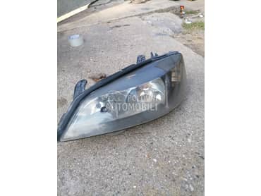 Levi far crni za Opel Astra G