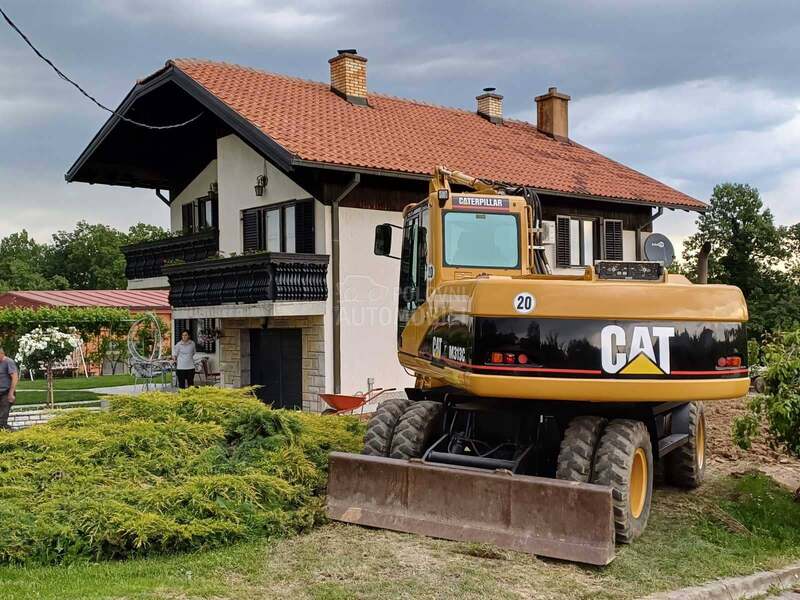 CAT M313C
