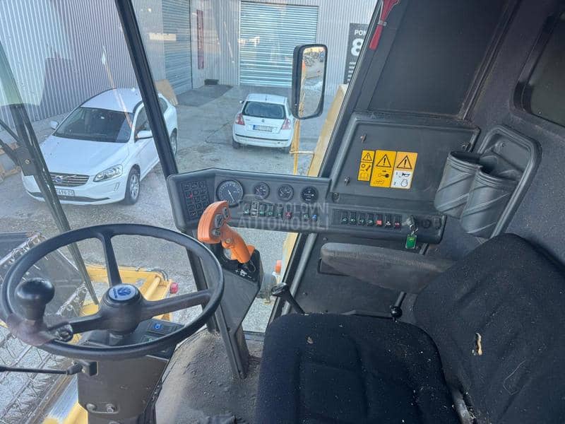 New Holland TC56 sa Sečkom