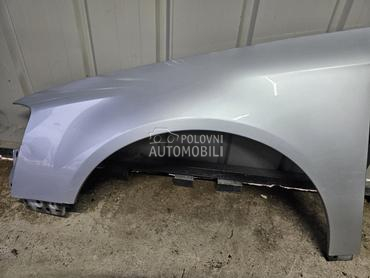 Levo krilo sivo LA7W za Volkswagen Passat B6