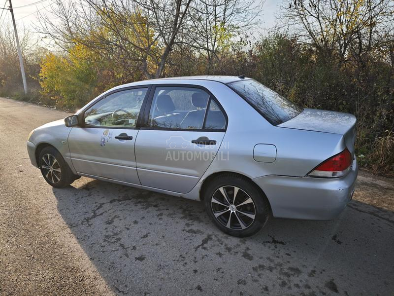 Mitsubishi Lancer Salon 1.3 SD MPI COM