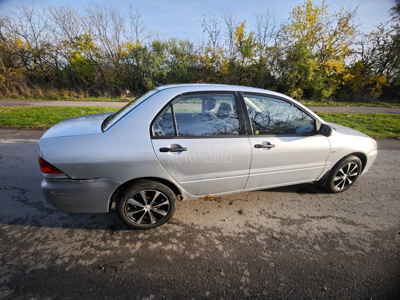 Mitsubishi Lancer Salon 1.3 SD MPI COM