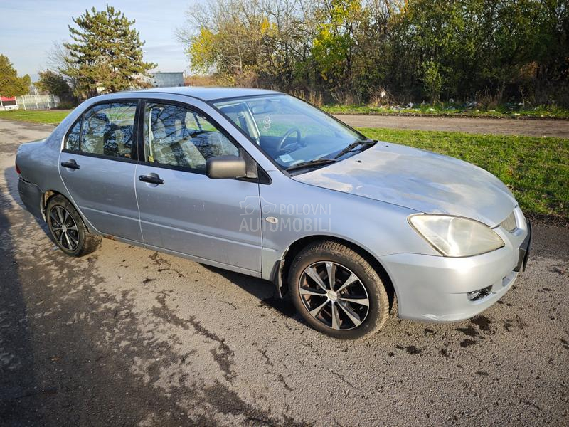 Mitsubishi Lancer Salon 1.3 SD MPI COM