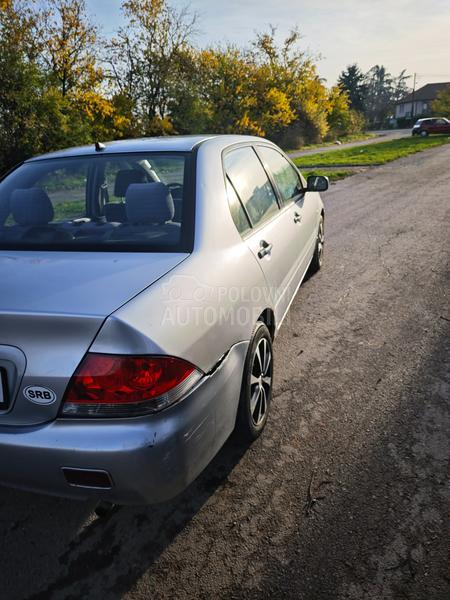Mitsubishi Lancer Salon 1.3 SD MPI COM