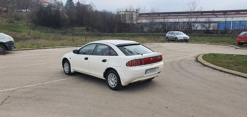 Mazda 323 O C U V A N A