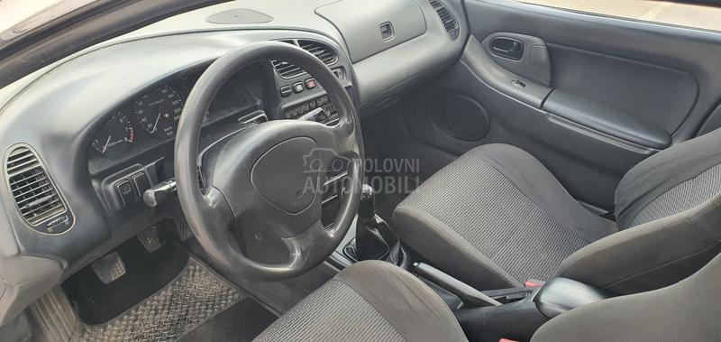 Mazda 323 O C U V A N A
