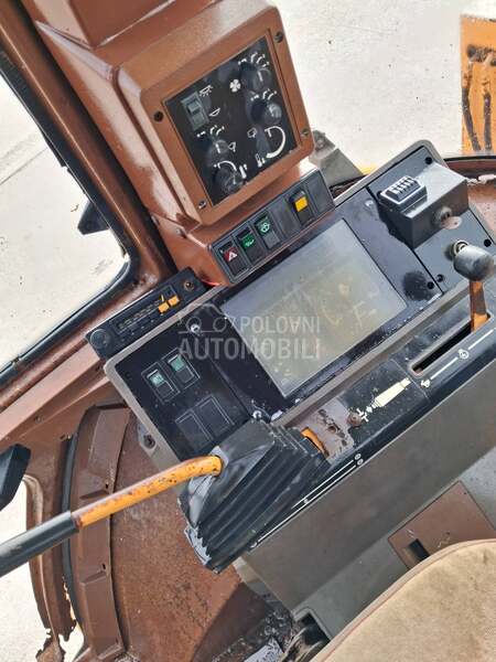 Case 580 K krokodilka teleskop