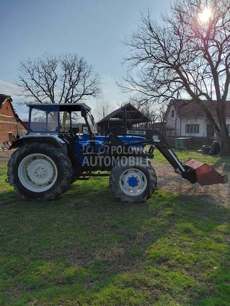 Ford 6610 sa utovarnom granom