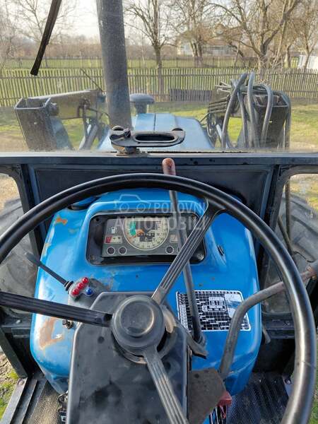 Ford 6610 sa utovarnom granom