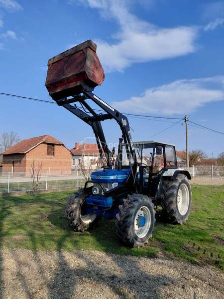 Ford 6610 sa utovarnom granom