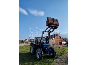 Ford 6610 sa utovarnom granom