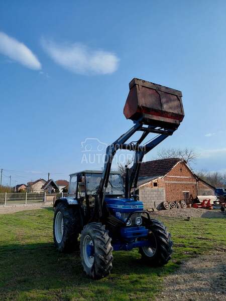 Ford 6610 sa utovarnom granom