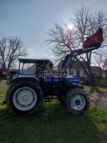 Ford 6610 sa utovarnom granom