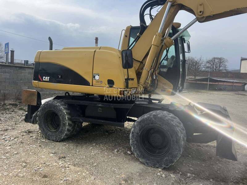 CAT M316C