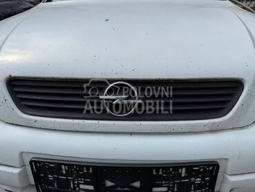 Maska sa znakom za Opel Astra G