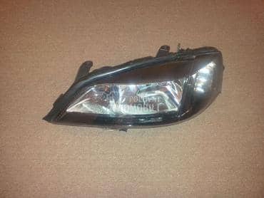 Far crni levi za Opel Astra G